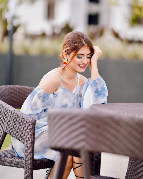 Model Arishfa Khan Sitting on Chair Pictures